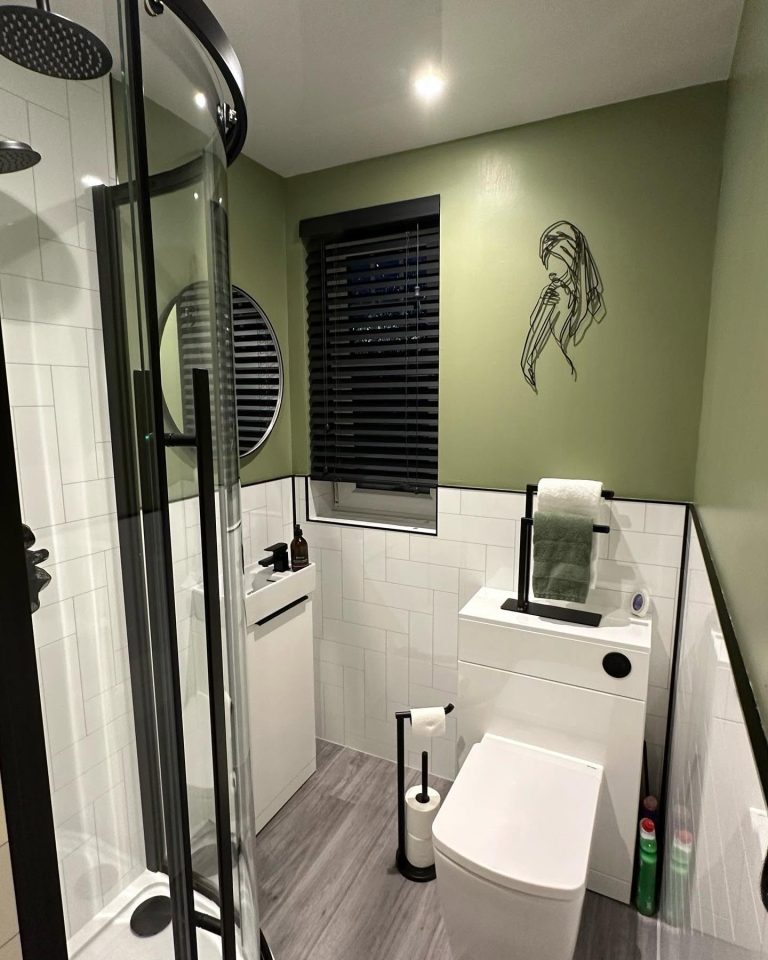 Stylish compact bathroom with a walk-in shower and space-saving design.
