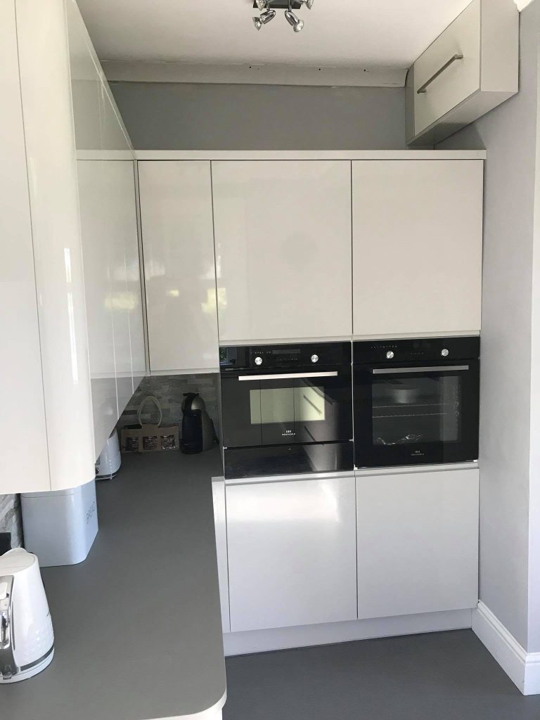 Complete kitchen renovation with modern cabinetry, worktops and integrated appliances.