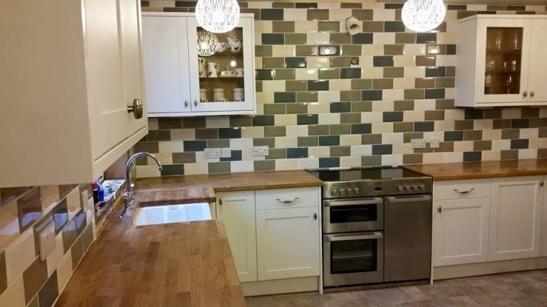 Complete kitchen renovation with modern cabinetry, worktops and integrated appliances.